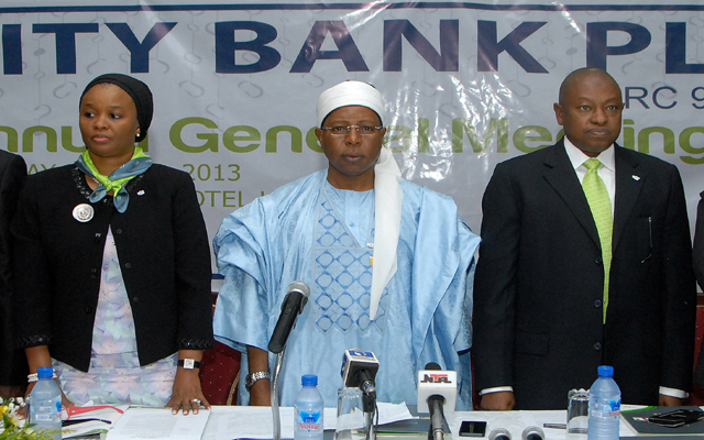 2.Nu'uman Barau Danbatta (middle) Chairman Board of Directors; addressing an issue from the report to shareholders. To his right is Ado Yakubu Wanka, The basnk's Managing Director; and to his left is Aisha A. Abraham, Company Secretary during the bank's Annual General meeting Bank Plc