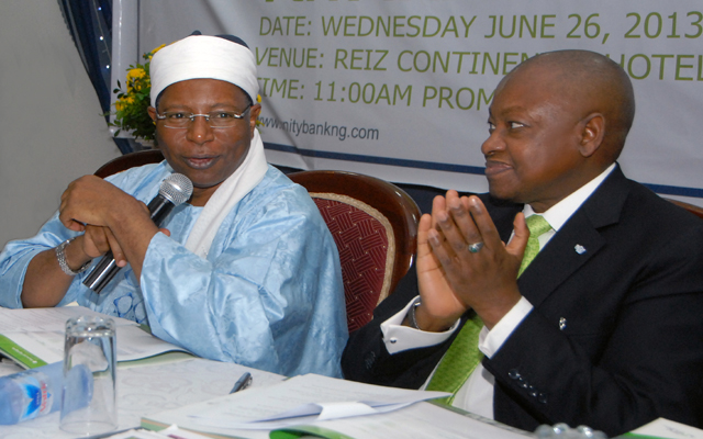 1.From R-L: Ado Yakubu Wanka, Managing Director; Nu'uman Barau Danbantta, Chairman Board of Directors; and Aisha A. Abraham, Company Secretary; all of Unity Bank Plc. singing the National Anthem to mark the beginning of the Bank's 7th Annual General Meeting at Reiz Continental Hotel, Abuja.
