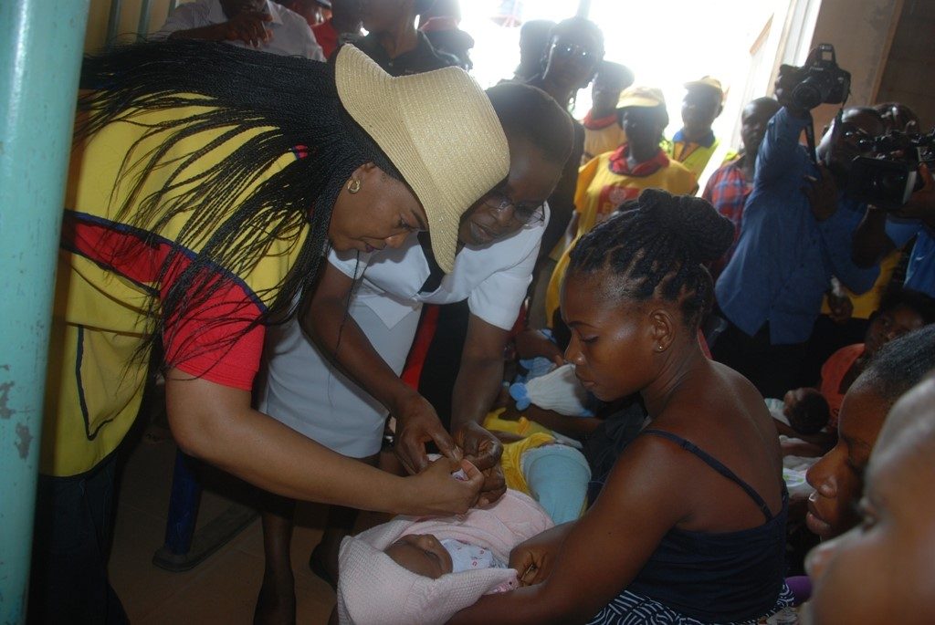 wife-of-enugu-state-governor-mrs-monica-ugwuanyi-immunizing-a-baby-as-part-of-activities-marking-world-polio-day-at-polly-clinic-asata-enugu-yesterday