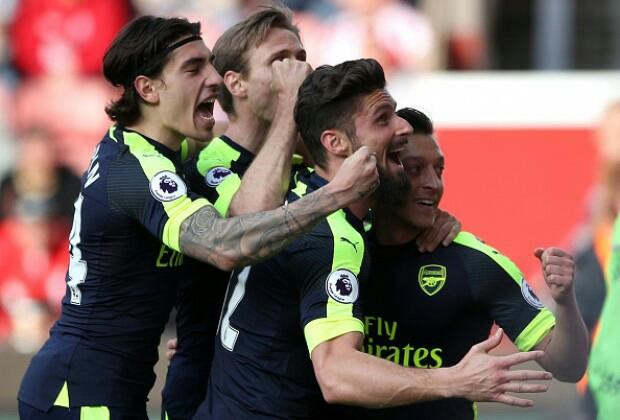 Arsenal thump Stoke City to boost top four hopes