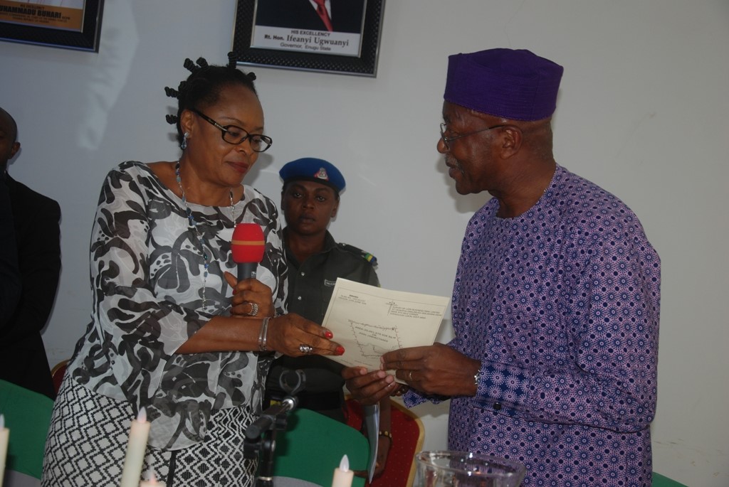 Deputy Governor of Enugu State, Mrs. Cecilia Ezeilo (left), presenting a  Certificate of Occupancy to the chairman of Lion Business Park Ltd, Mr. Chris Mbonu, on land for the establishment of Industrial Market (Lion Business Park), during a ceremony when  the three host communities received a cheque of N300m compensation for their land. It held at the Government House, Enugu, yesterday.