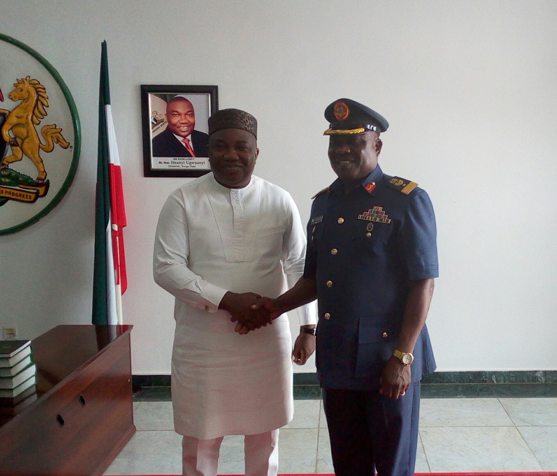 Gov. Ifeanyi Ugwuanyi of Enugu State (left) with the new Commander, 553 Base Services Group, Nigerian Airforce, Enugu, Air Commodore Emmanuel O. Akinbayo, when the latter paid a maiden courtesy visit to the Government House, Enugu, yesterday.