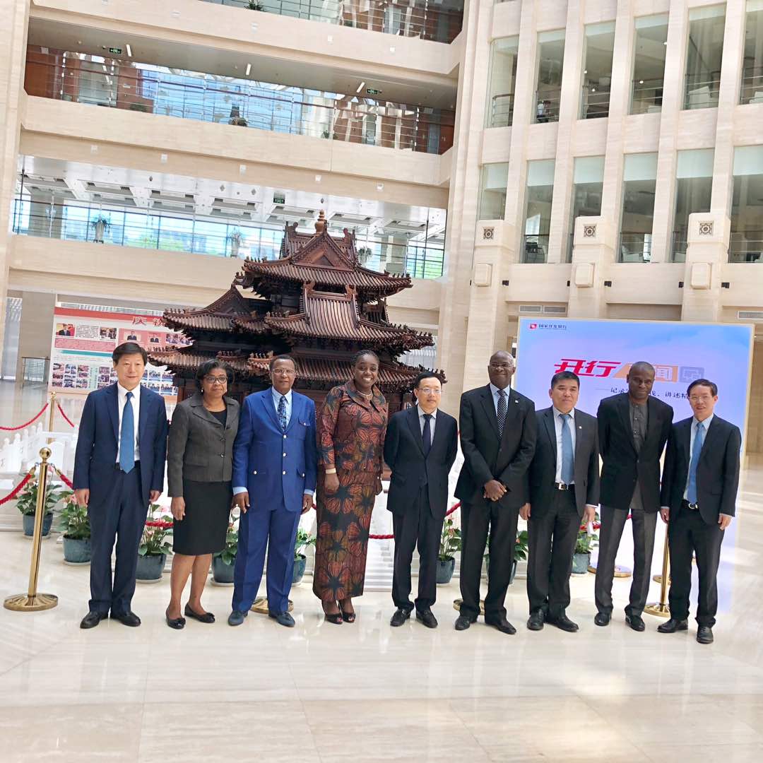 The Director General of Debt Management Office, Patience Oniha (second left); Honourable Minister of Finance, Mrs. Kemi Adeosun (fourth left); Executive Vice President, China Development Bank, Mr Zhang Xuguang (middle); Honourable Minister of Power, Works & Housing, Mr Babatunde Fashola SAN (fourth right);Permanent Secretary, Power, Mr. Louis Edozien (2nd right) in a group photograph shortly after a meeting on key infrastructure projects in Nigeria with China Development Bank officials in China on Thursday, 31st May, 2018
