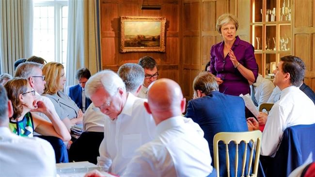Theresa May in fight to save govt as two ministers resign