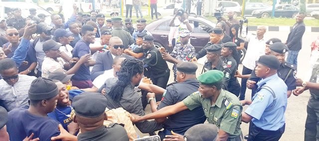 Protesters storm Police HQ, demand release of Premium Times reporter