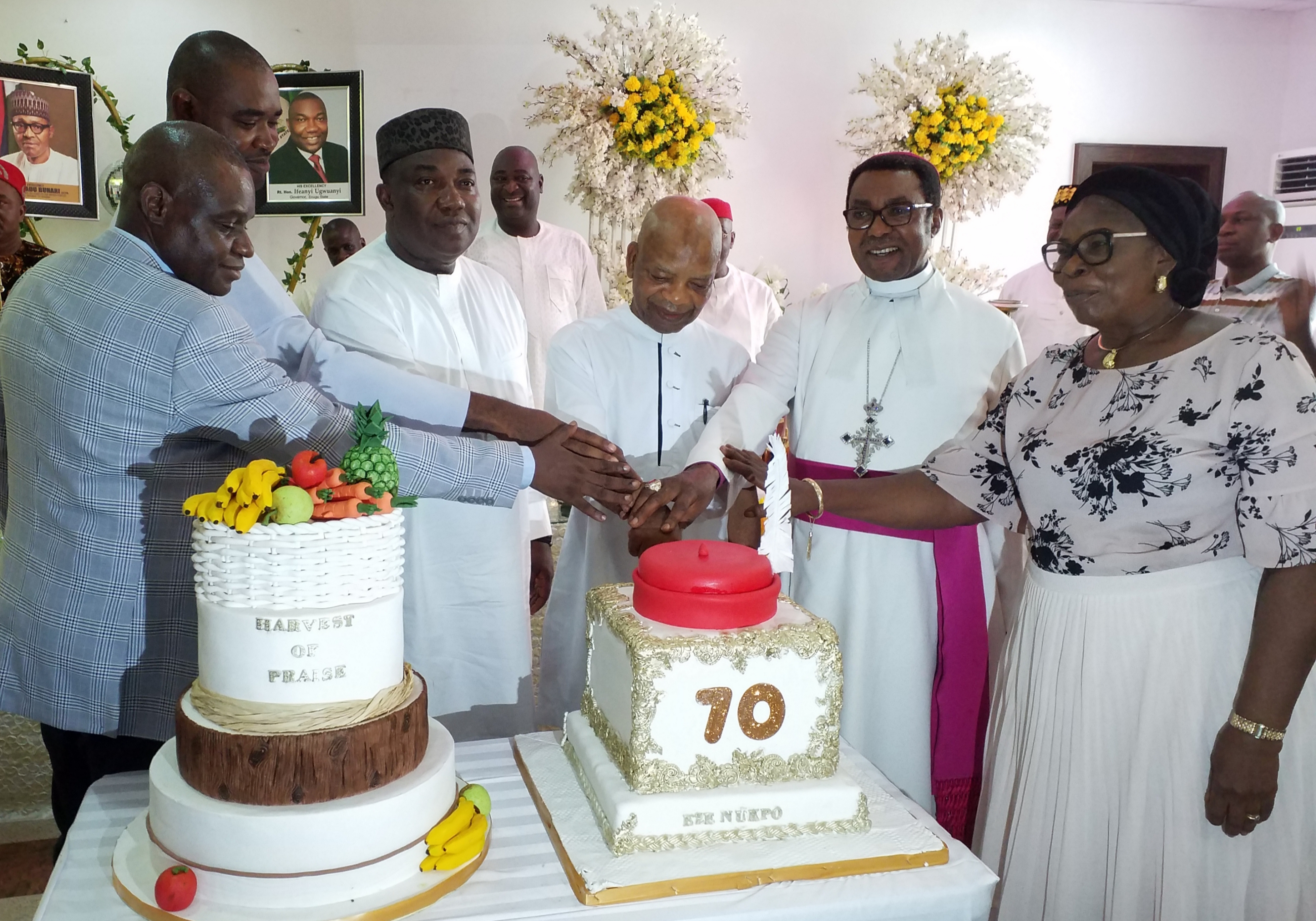 70th BIRTHDAY: Governor Ifeanyi Ugwuanyi of Enugu State (3rd left) with Prince Engr. Dr. Arthur Eze (middle); Archbishop of Enugu Ecclesiastical Province (Anglican Communion), Most Rev. Dr. Emmanuel Chukwuma (2nd right); his wife, Joyce (right); Commissioner of Police, Enugu State Command, Danmallam Mohammed (left), and the Chaplain, Government House Chaplaincy, Enugu, Rev. Fr. Chinedu Ozoude, when the governor organised a luncheon for Prince Eze to celebrate his 70th birthday, at the Government House, Enugu, yesterday.