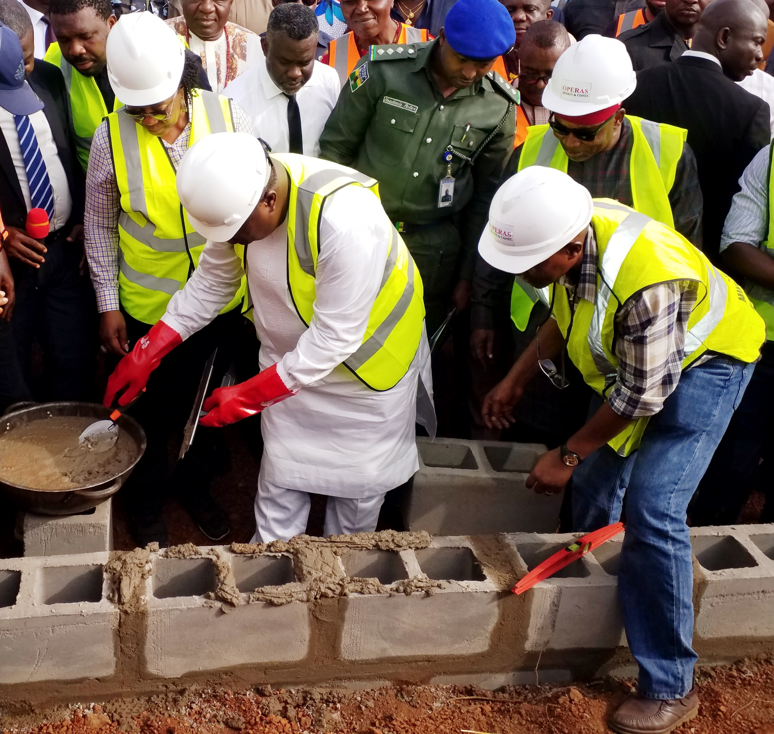 Enugu State Governor and Governor-elect, Rt. Hon. Ifeanyi Ugwuanyi (middle) laying the foundation for the administrative building of Enugu State University of Education, Ihe, Awgu Local Government Area, yesterday. With him are the Commissioner for Works and Infrastructure, Engr. Greg Nnaji (right) and Chairman of Governing Council, Enugu State College of Education (Technical), Amb. Mrs. Fidelia Njeze (left).