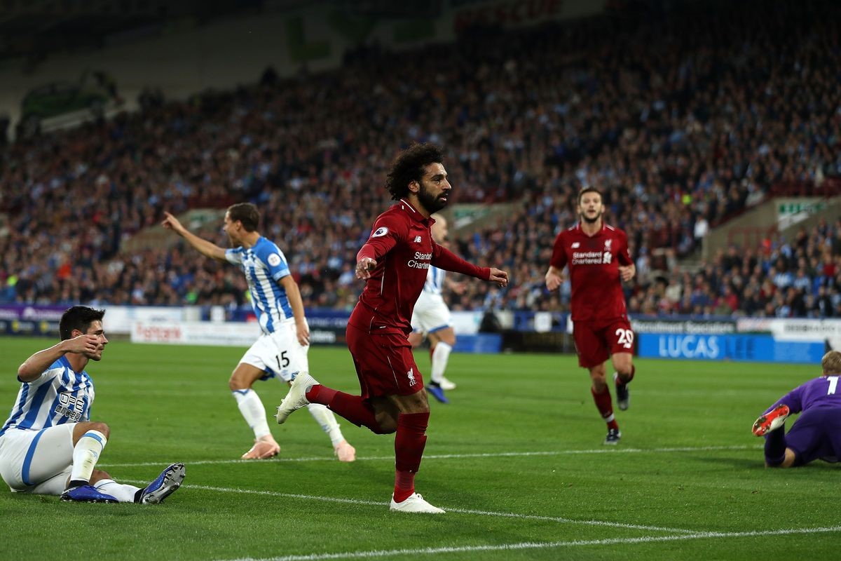 Liverpool rout Huddersfield to tighten grip on Premier League crown