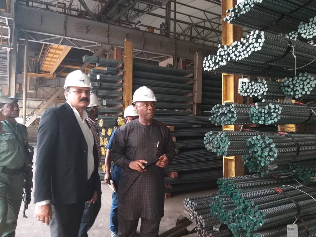 PSML Chief Executive Officer Prasanta Mishra show businesspersons finished products of the one million tons per annum rolling mill at Ovwian-Aladja Delta State when they came on tour of the factory recently. 
