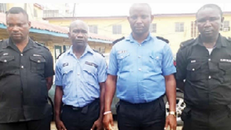 Four police officers in custody for killing disarmed suspects
