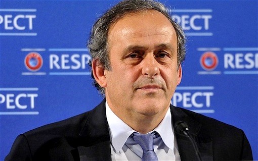 Platini returns to football after four-year ban