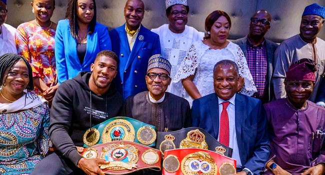 Anthony Joshua presents heavyweight titles to Buhari in UK