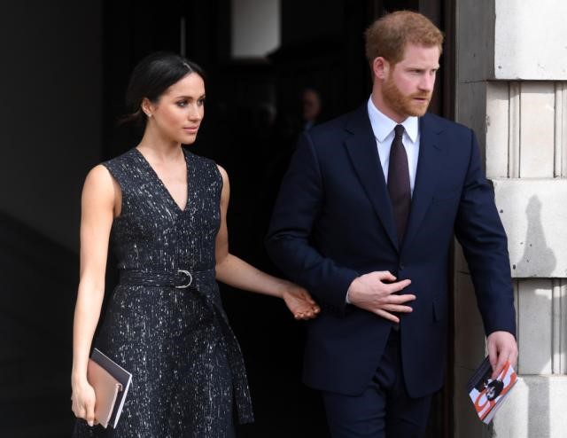 Prince Harry, wife step back from Royal Family