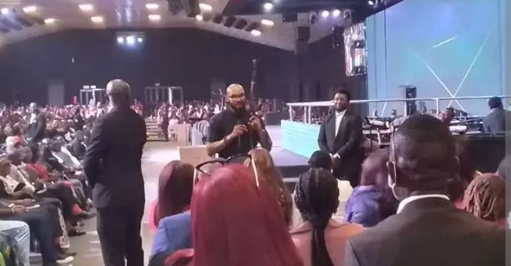 Abuja pastor brings AK 47 gun to altar