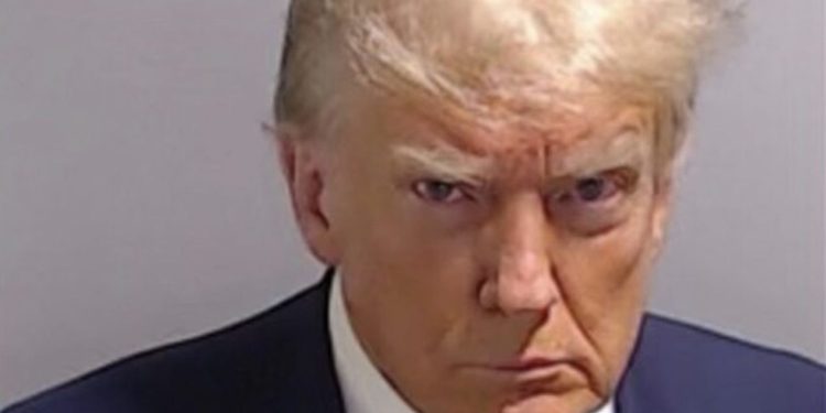 Trump mug shot surfaces after arrest in election case