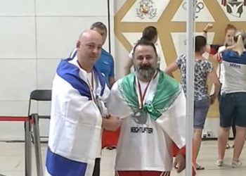 Iran bans weightlifter for life over handshake with Israeli