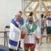 Iran bans weightlifter for life over handshake with Israeli