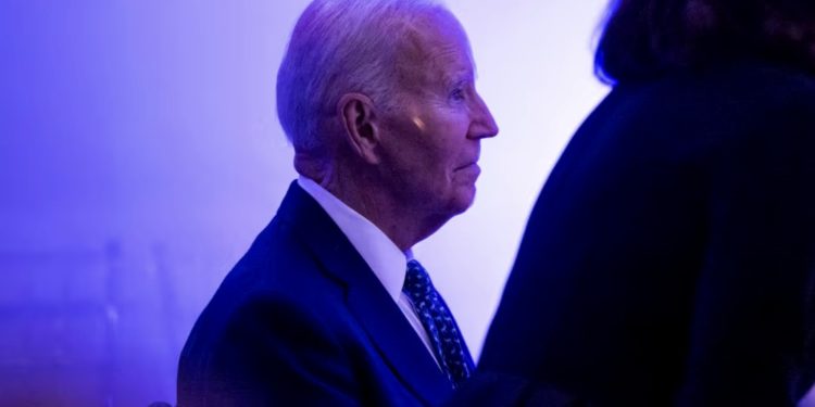 Biden warns of dark days for U.S