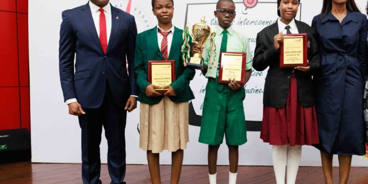 L-R: Group Managing Director, United Bank for Africa, (UBA Plc) Oliver Alawuba; Winner, 2025 UBA Foundation National Essay Competition and student of Igando Community Senior High School, Ebunoluwa Seth Oluwatimelehin; and Managing Director/CEO, UBA Foundation, during the grand finale of the 2025 UBA Foundation National Essay Competition for senior school students in Nigeria held at UBA House, Lagos, on Tuesday.