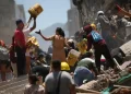 Rescuers scramble for survivors with 180 dead in Colombia earthquake